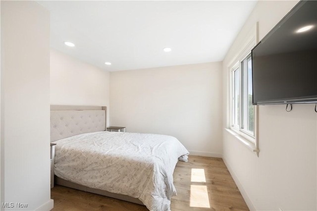 472 Saunders Ave, Coventry, OH 44319 - bedroom featuring wood finished floors, baseboards, and recessed lighting