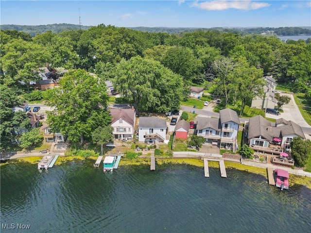 472 Saunders Ave, Coventry, OH 44319 - aerial view of residential area featuring a large body of water and a heavily wooded area