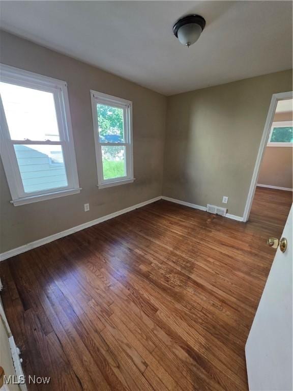 3801 Archmere Ave, Old Brooklyn, OH 44109 - spare room with healthy amount of natural light, wood finished floors, and baseboards