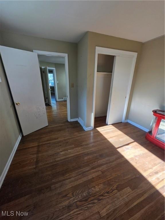 3801 Archmere Ave, Old Brooklyn, OH 44109 - unfurnished bedroom with wood finished floors, baseboards, and a closet