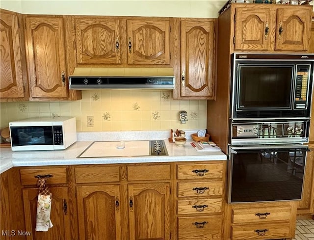 904 Donegal Dr W, Follansbee, WV 26037 - kitchen with black appliances, extractor fan, light countertops, and brown cabinetry