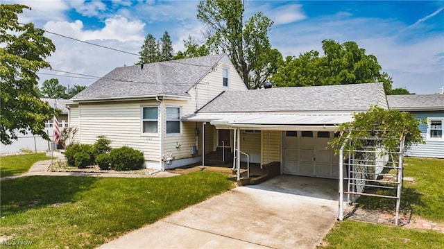 1303 28th St, Vienna, WV 26105 - view of front facade with a shingled roof, an attached garage, driveway, and a front yard