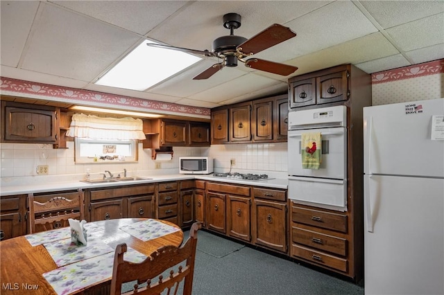 1303 28th St, Vienna, WV 26105 - kitchen featuring white appliances, a warming drawer, open shelves, a sink, and a paneled ceiling