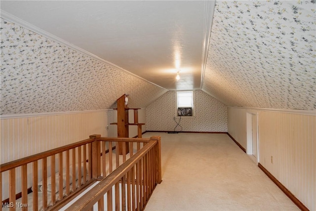 1303 28th St, Vienna, WV 26105 - bonus room with wallpapered walls, light colored carpet, and lofted ceiling