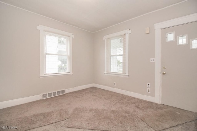 4101 E 64th St, Cleveland, OH 44105 - entryway featuring carpet floors, crown molding, and baseboards