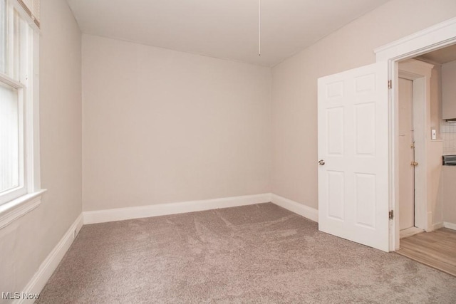 4101 E 64th St, Cleveland, OH 44105 - carpeted empty room with baseboards