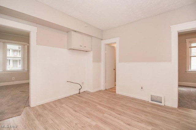 4101 E 64th St, Cleveland, OH 44105 - unfurnished room featuring light wood finished floors and baseboards