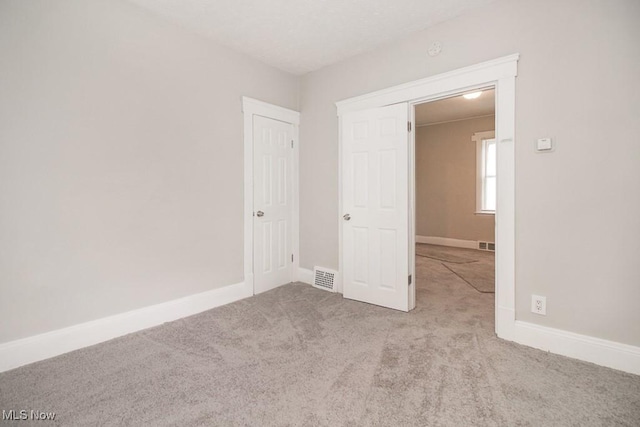 4101 E 64th St, Cleveland, OH 44105 - unfurnished bedroom featuring carpet floors and baseboards
