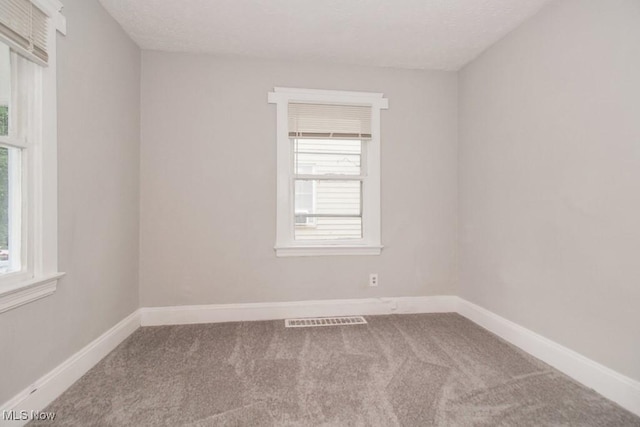 4101 E 64th St, Cleveland, OH 44105 - carpeted spare room featuring baseboards