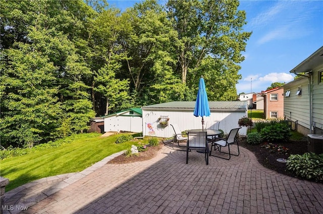 962 N Market St, Lisbon, OH 44432 - view of patio / terrace with central AC unit and outdoor dining space
