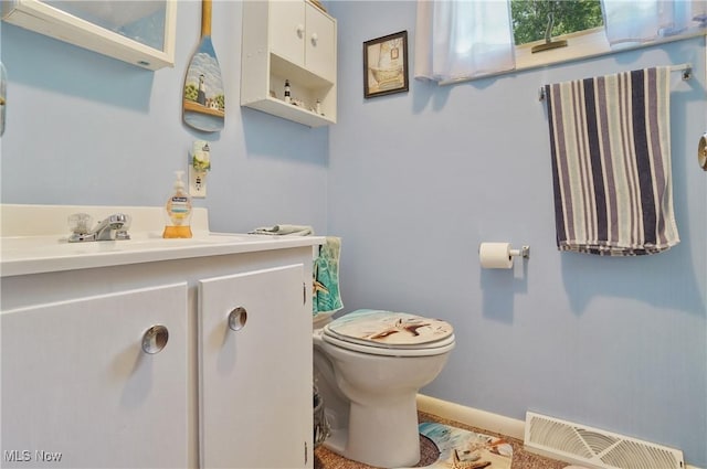 962 N Market St, Lisbon, OH 44432 - half bath featuring toilet, vanity, and baseboards