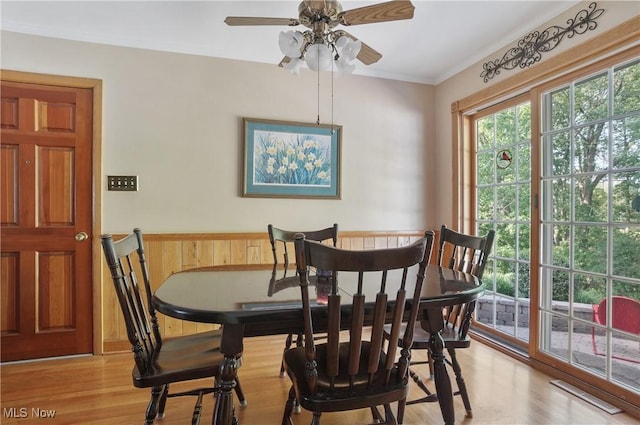 962 N Market St, Lisbon, OH 44432 - dining area with wood finished floors, ceiling fan, crown molding, and wainscoting