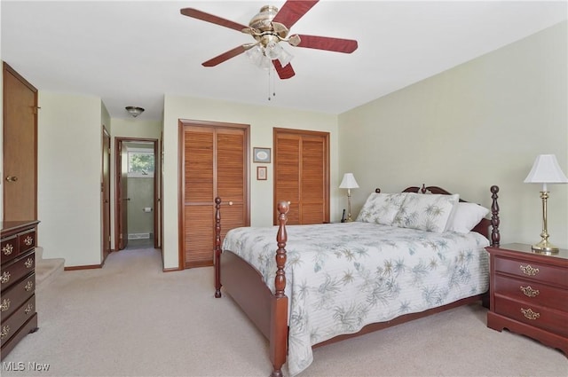 962 N Market St, Lisbon, OH 44432 - bedroom with two closets, light colored carpet, ceiling fan, and baseboards