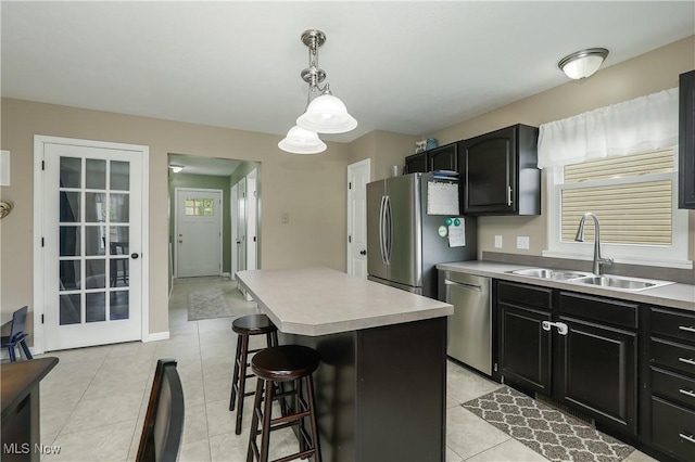 189 Booth Bay Dr, Medina, OH 44256 - kitchen with stainless steel appliances, a sink, a breakfast bar, and light countertops
