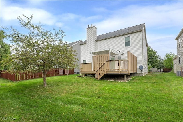 189 Booth Bay Dr, Medina, OH 44256 - rear view of house featuring a wooden deck, a chimney, and central AC