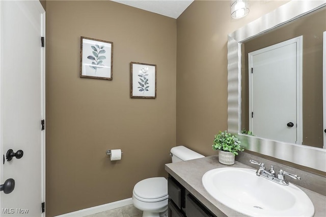 189 Booth Bay Dr, Medina, OH 44256 - half bath featuring toilet, vanity, baseboards, and tile patterned floors