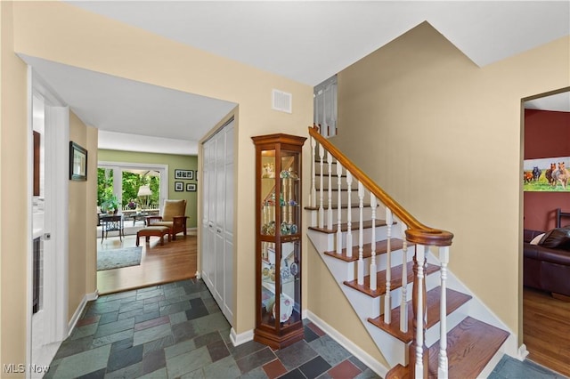 177 N Park Dr, Aurora, OH 44202 - stairs with stone tile floors and baseboards