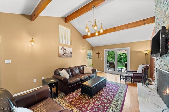 177 N Park Dr, Aurora, OH 44202 - living area featuring a stone fireplace, wood finished floors, and a chandelier