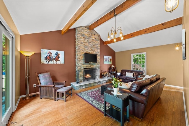 177 N Park Dr, Aurora, OH 44202 - living area featuring wood finished floors, a chandelier, and a fireplace