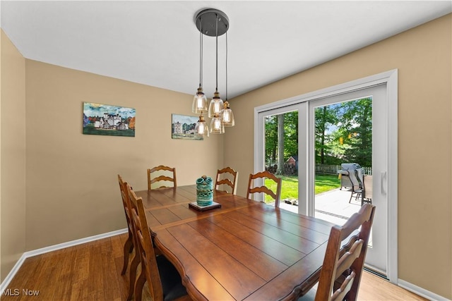 177 N Park Dr, Aurora, OH 44202 - dining area featuring light wood-style flooring and a chandelier