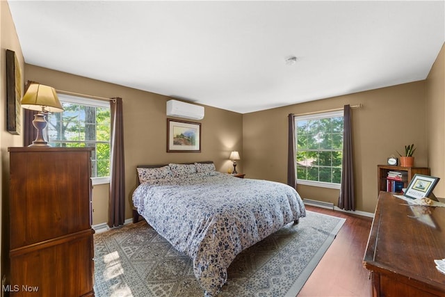 177 N Park Dr, Aurora, OH 44202 - bedroom featuring a wall mounted air conditioner and wood finished floors