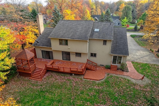 30965 Woodall, Solon, OH 44139 - back of property with roof with shingles, a chimney, a wooden deck, and a lawn