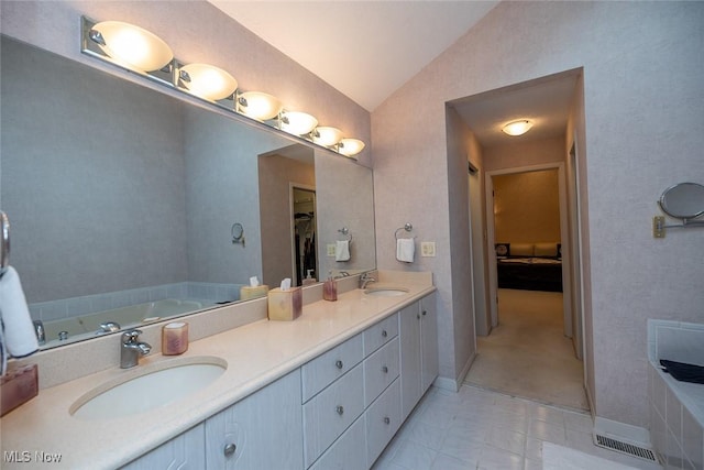 30965 Woodall, Solon, OH 44139 - bathroom featuring vaulted ceiling, a bath, double vanity, and a spacious closet