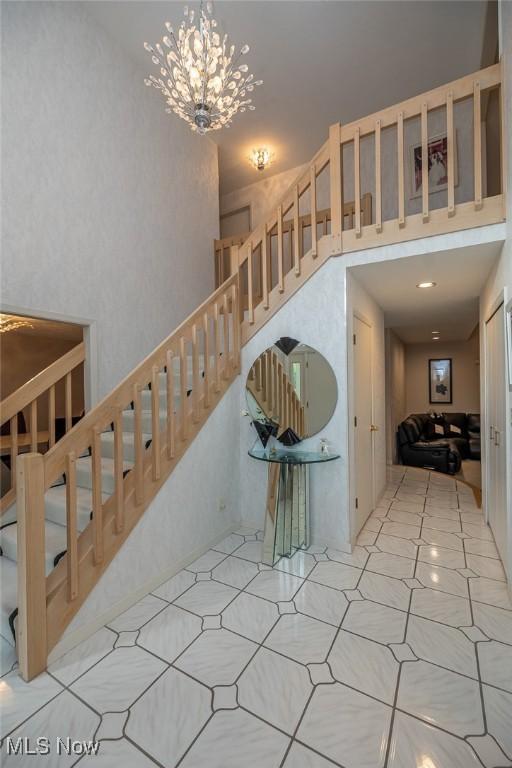 30965 Woodall, Solon, OH 44139 - staircase with a towering ceiling and a chandelier