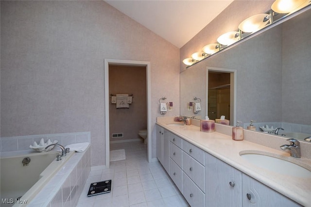 30965 Woodall, Solon, OH 44139 - full bath with double vanity, lofted ceiling, a garden tub, tile patterned floors, and toilet
