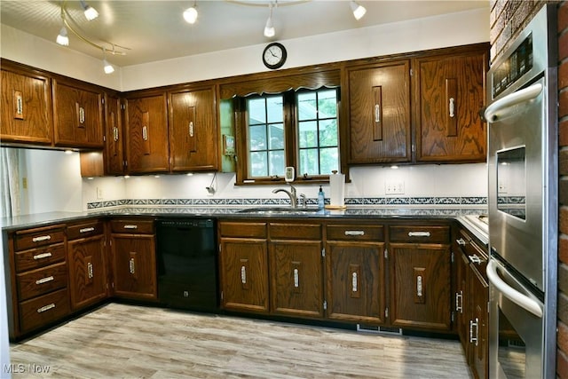 6739 Stewart Sharon Rd, Brookfield, OH 44403 - kitchen featuring black dishwasher, stainless steel double oven, a sink, and light wood-style floors