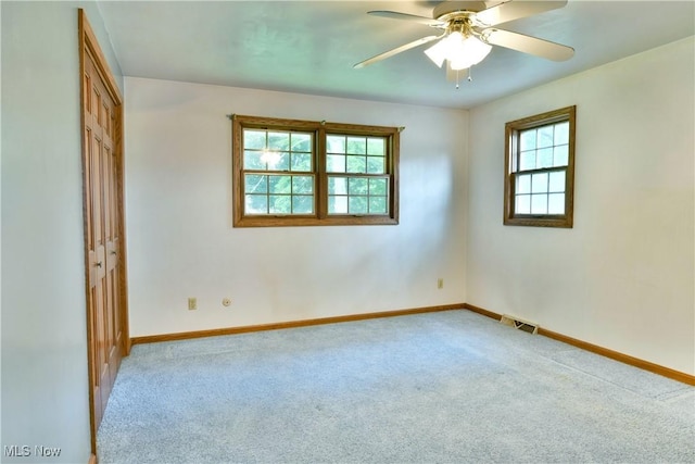 6739 Stewart Sharon Rd, Brookfield, OH 44403 - carpeted empty room featuring baseboards and a ceiling fan