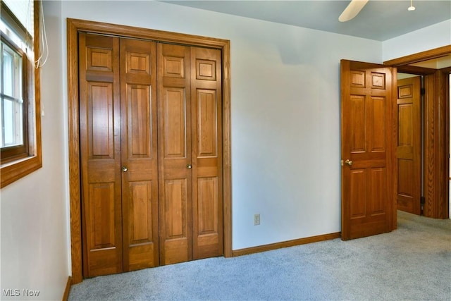6739 Stewart Sharon Rd, Brookfield, OH 44403 - carpeted bedroom with a closet, baseboards, and a ceiling fan