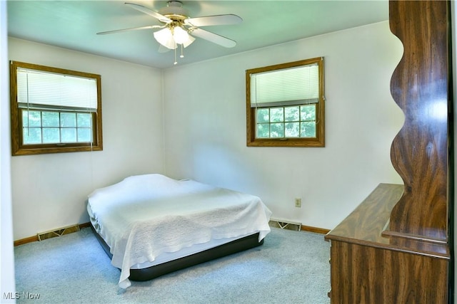 6739 Stewart Sharon Rd, Brookfield, OH 44403 - carpeted bedroom with baseboards and a ceiling fan