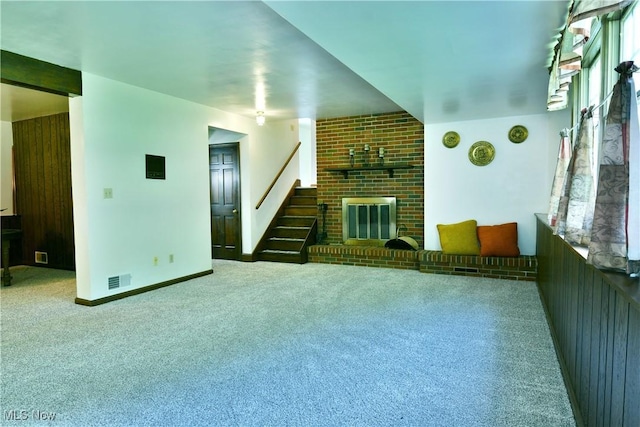 6739 Stewart Sharon Rd, Brookfield, OH 44403 - carpeted living room with stairs, a brick fireplace, and baseboards