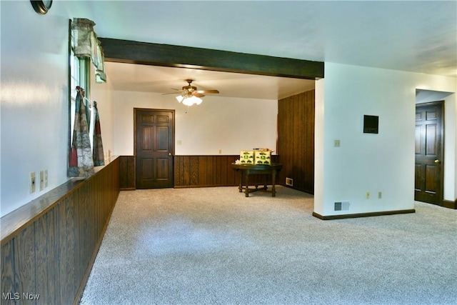 6739 Stewart Sharon Rd, Brookfield, OH 44403 - carpeted spare room featuring wooden walls, a ceiling fan, a wainscoted wall, and beam ceiling