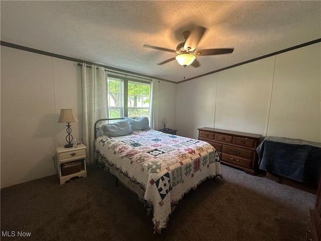 301 46th St SW, Canton, OH 44706 - bedroom with ornamental molding, a textured ceiling, dark colored carpet, ceiling fan, and a decorative wall