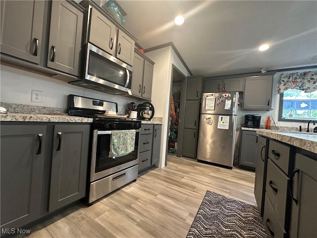 301 46th St SW, Canton, OH 44706 - kitchen with appliances with stainless steel finishes, gray cabinets, light wood-style floors, and recessed lighting