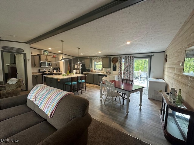 301 46th St SW, Canton, OH 44706 - living area featuring dark wood-style floors, beamed ceiling, and recessed lighting
