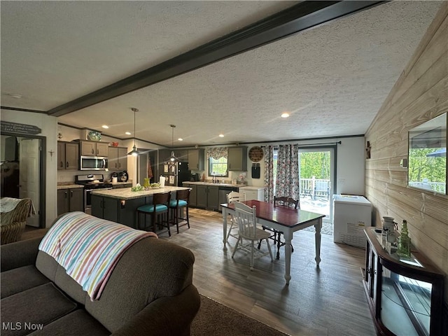 301 46th St SW, Canton, OH 44706 - dining area featuring dark wood finished floors, a textured ceiling, beamed ceiling, and recessed lighting