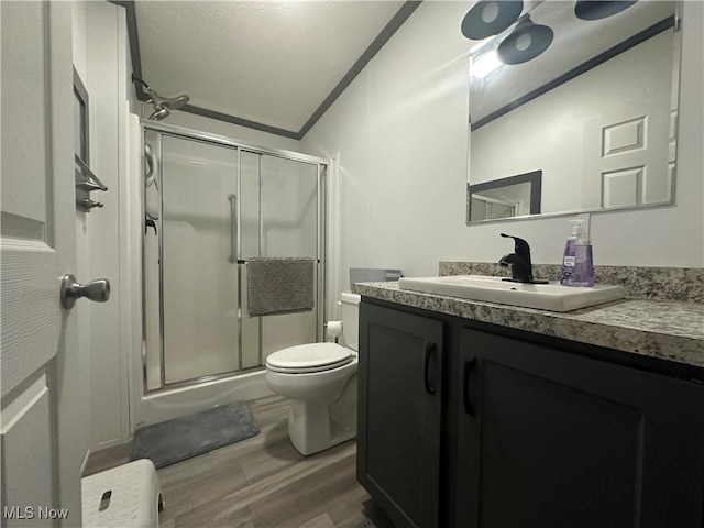 301 46th St SW, Canton, OH 44706 - bathroom with toilet, wood finished floors, vanity, and a stall shower