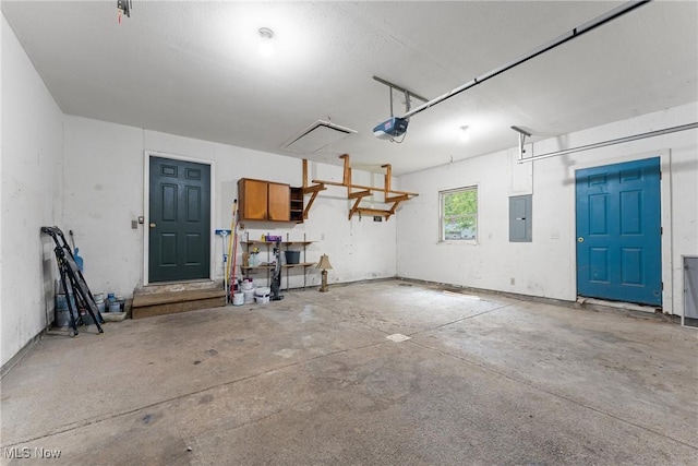 7183 Hunter Dr, Chippewa Lake, OH 44215 - garage featuring electric panel and a garage door opener
