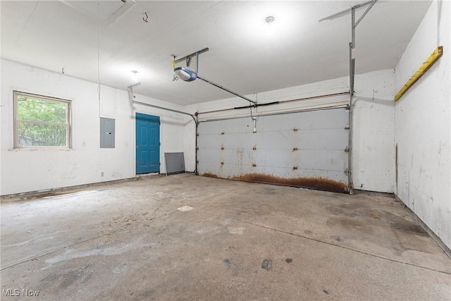 7183 Hunter Dr, Chippewa Lake, OH 44215 - garage featuring electric panel and a garage door opener