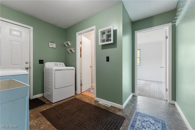 7183 Hunter Dr, Chippewa Lake, OH 44215 - laundry room featuring washer / clothes dryer and baseboards
