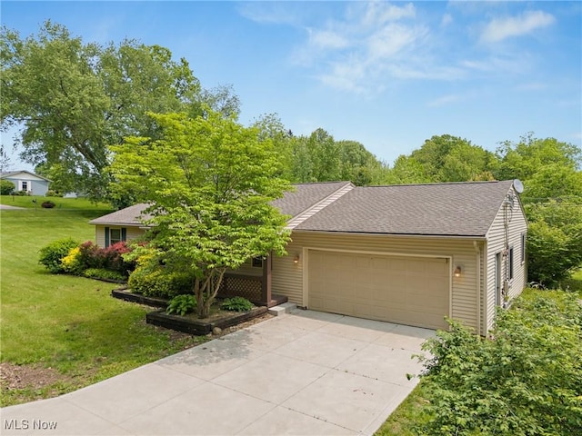 7183 Hunter Dr, Chippewa Lake, OH 44215 - view of property hidden behind natural elements with an attached garage, driveway, and a front lawn