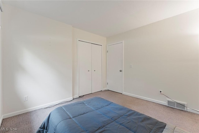 7183 Hunter Dr, Chippewa Lake, OH 44215 - bedroom with carpet flooring, baseboards, and a closet