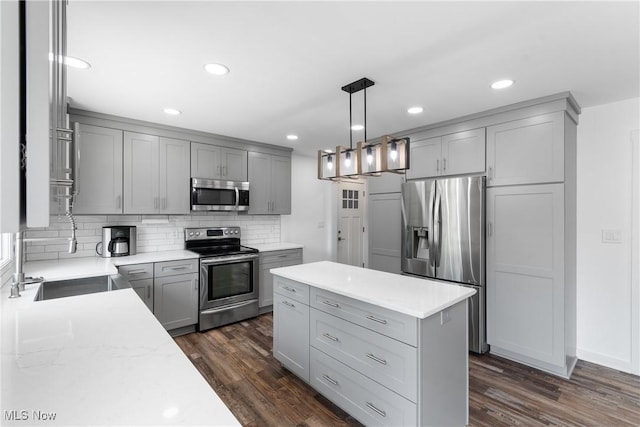 1892 Toepfer Rd, Akron, OH 44312 - kitchen featuring stainless steel appliances, gray cabinetry, tasteful backsplash, and recessed lighting