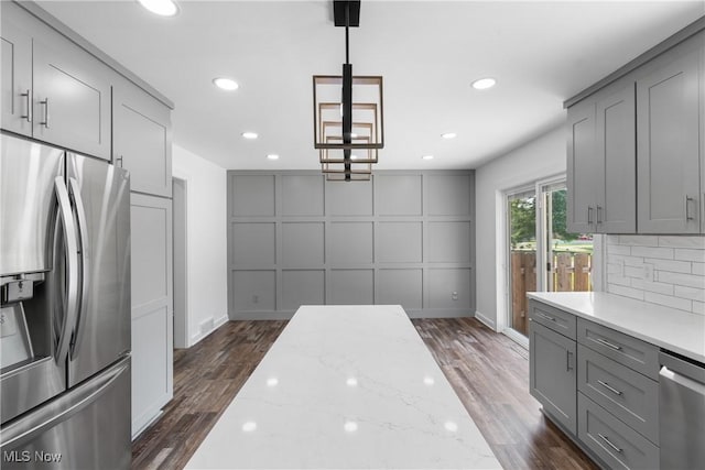 1892 Toepfer Rd, Akron, OH 44312 - kitchen with stainless steel appliances, gray cabinetry, dark wood-style flooring, backsplash, and recessed lighting