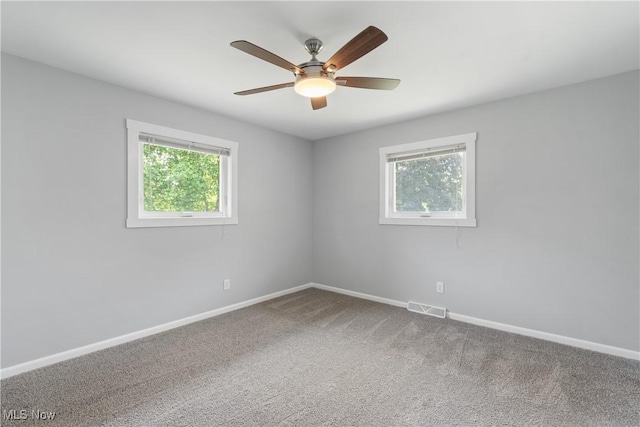 1892 Toepfer Rd, Akron, OH 44312 - unfurnished room featuring baseboards, ceiling fan, and carpet flooring