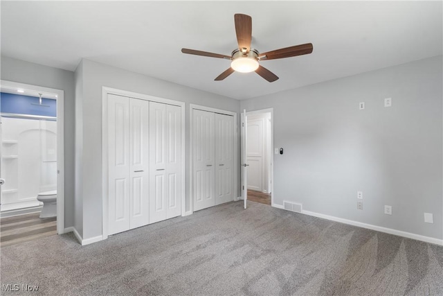 1892 Toepfer Rd, Akron, OH 44312 - unfurnished bedroom with carpet flooring, baseboards, multiple closets, ensuite bathroom, and ceiling fan