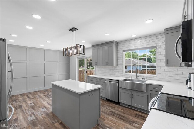 1892 Toepfer Rd, Akron, OH 44312 - kitchen with appliances with stainless steel finishes, gray cabinetry, a sink, a center island, and recessed lighting